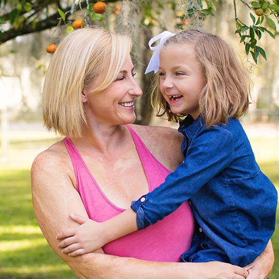 Photo of Rebekah Johnson laughing with her daughter